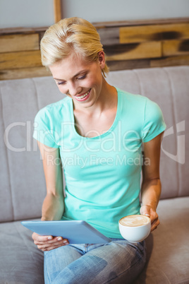 Pretty blonde using laptop computer Pretty blonde using laptop computer