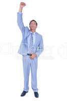 Businessman cheering with clenched fist
