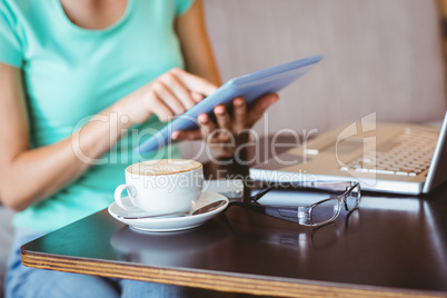 A woman using tablet computer