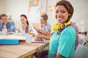 Pretty casual businesswoman with yellow headphones