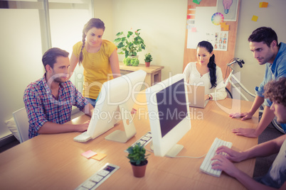 Attentive business team working on laptops