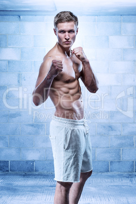 Male fitness model wearing white shorts