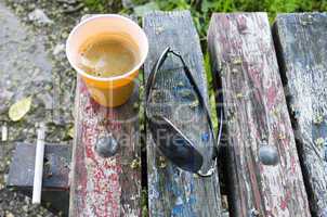 Espresso coffee on old wooden bench