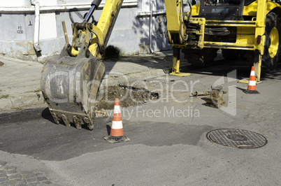 Public street maintenance works, excavator