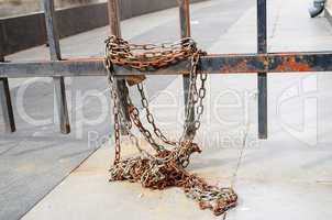 Rusty fence and chain