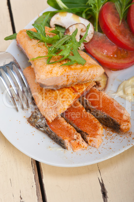 grilled samon filet with vegetables salad