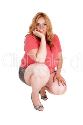A crouching plus size woman.