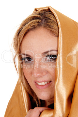 Woman with gold fabric on head.