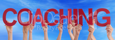 Hands Holding Red Straight Word Coaching Blue Sky