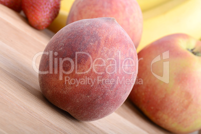 fruits on wooden table, peach, apple, bananas, food concept