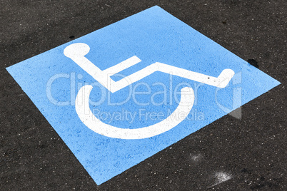 disabled sign on asphalt
