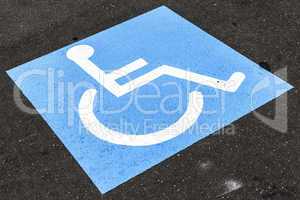 disabled sign on asphalt