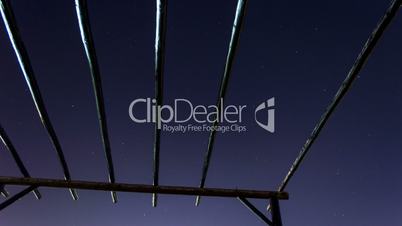 night sky through roof terrace with wooden beams