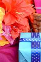 present gift box and flower bouquet on silk