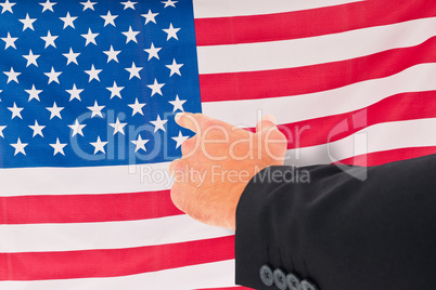 Composite image of businessman pointing with his finger