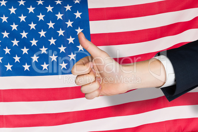 Composite image of hand showing thumbs up