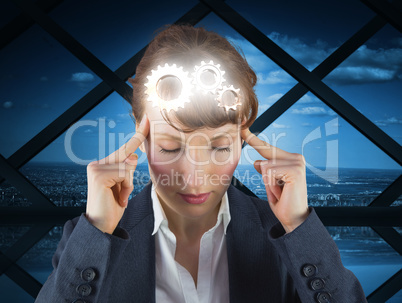 Composite image of stressed businesswoman