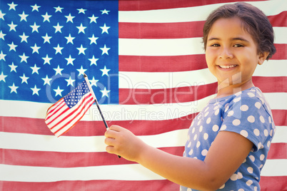 Composite image of cute girl with american flag