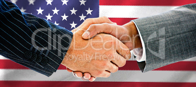 Composite image of business people shaking hands