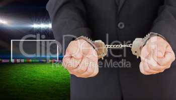 Composite image of handcuffed businessman