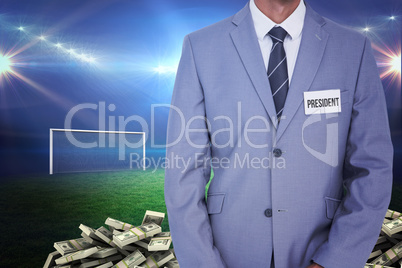 Composite image of businessman with badge