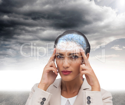 Composite image of young businesswoman putting her fingers on he