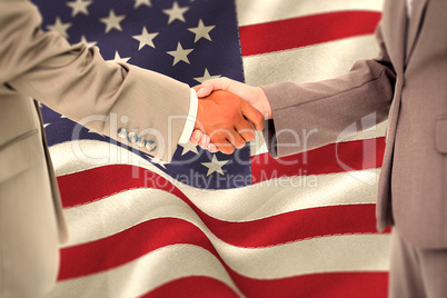 Composite image of side view of shaking hands