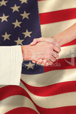 Composite image of extreme closeup of a doctor and patient shaki