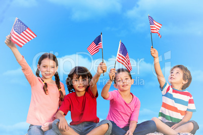Composite image of children with american flags