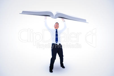 Composite image of businessman with arms up