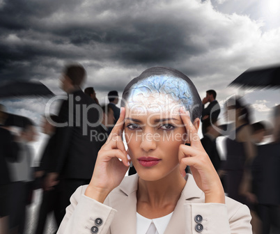 Composite image of young businesswoman putting her fingers on he