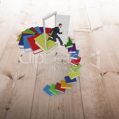 Composite image of geeky young businessman running mid air