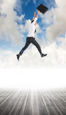 Composite image of businessman leaping with his briefcase