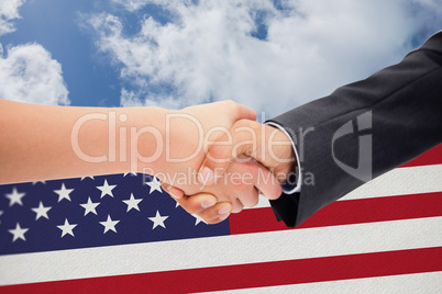 Composite image of close up of a handshake