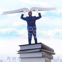 Composite image of businessman climbing on a cube with arms out
