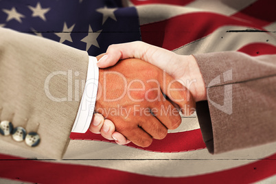 Composite image of side view of business peoples hands shaking