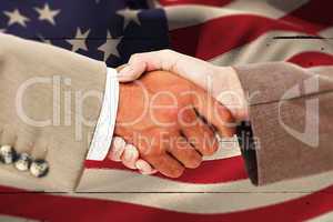 Composite image of side view of business peoples hands shaking