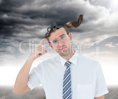 Composite image of geeky businessman thinking with finger on tem