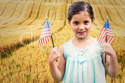 Composite image of cute girl with american flag