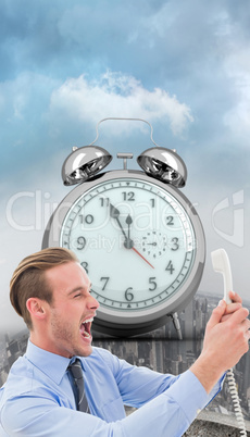 Composite image of businessman shouting at phone