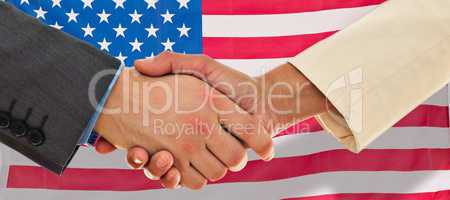 Composite image of closeup of shaking hands over eye glasses and