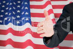 Composite image of businessman extending arm for handshake