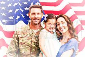 Composite image of soldier reunited with family