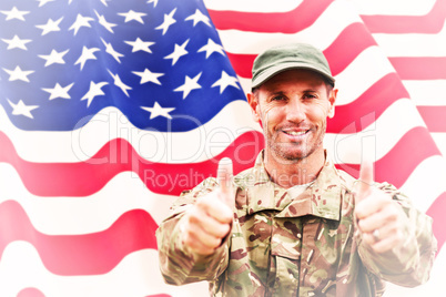 Composite image of soldier showing thumbs up