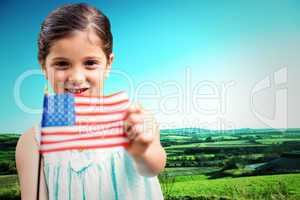 Composite image of cute girl with american flag