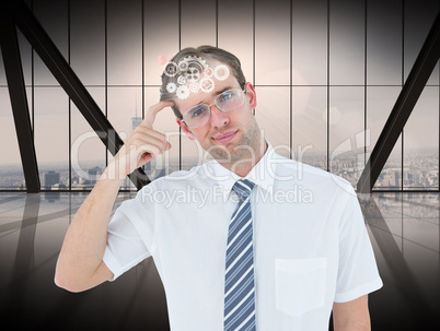 Composite image of geeky businessman thinking with finger on tem
