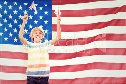 Composite image of cute boy with american flag