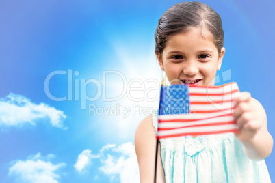 Composite image of cute girl with american flag