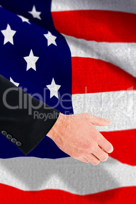 Composite image of businessman holding something with his hands