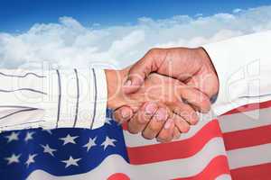 Composite image of business people shaking hands
